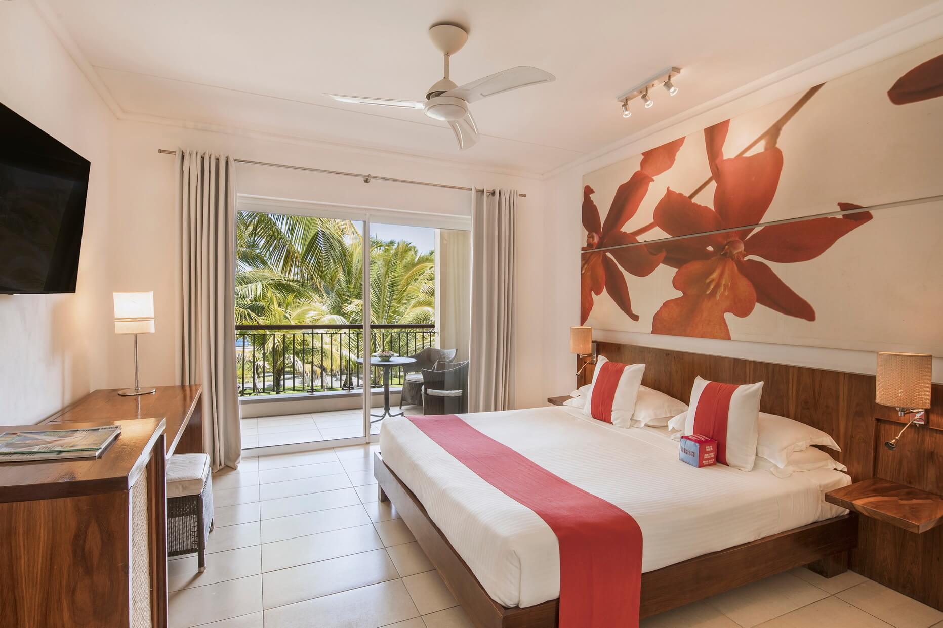 Tamassa Resort standard Room Bed and Tv