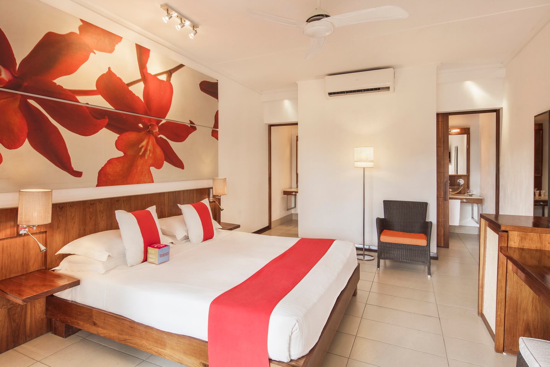 Tamassa Resort standard Room bed and Bathroom